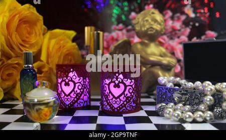 Yellow Roses With Perfume and Jewelry on VAnity Table Stock Photo