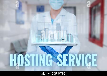 Sign displaying Hosting Service. Business approach provides services for the website to be seen in the Internet Man In Uniform Standing Holding Tablet Stock Photo