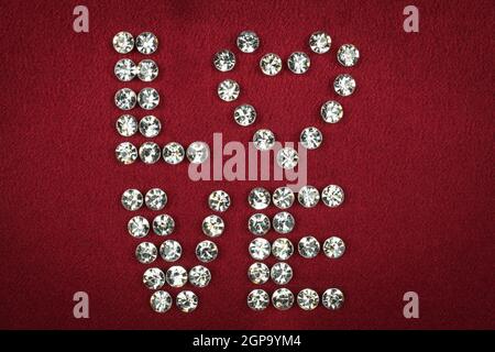 Word LOVE laid out rhinestones, can be used as background Stock Photo