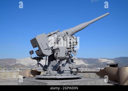 Artillery battle cannon, raised from the bottom of the Black Sea. Weapons of defense in the Second World War. The restored exhibit. Stock Photo