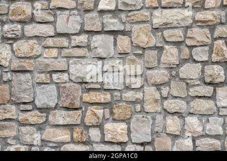 Decorative stone wall. Ideal for textures and backgrounds. Stock Photo