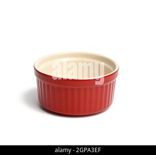 red ceramic round cupcake baking dishes isolated on white background, close up Stock Photo