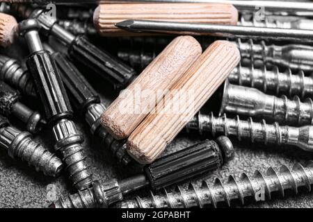 Dowels, different screws and nails on table, closeup Stock Photo
