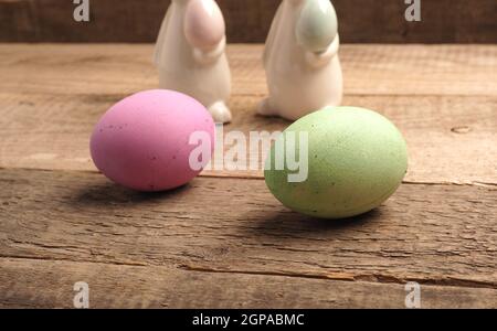 Naturally colored organic eggs on a rustic table with space for text, Easter background Stock Photo