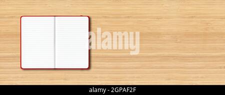 Red open lined notebook mockup isolated on wooden background. Horizontal banner Stock Photo