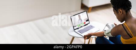 African American Patient Testing Blood Pressure In Telehealth Telemedicine Call Stock Photo