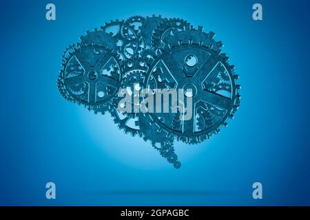 Human brain with metallic gears on blue background Stock Photo
