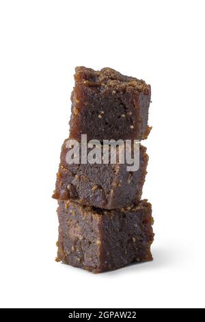 dodol isolated on white background, also called kalu dodol, sri lankan dark sweet candy, made from coconut milk, jaggery and rice flour Stock Photo