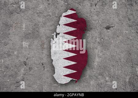 Map and flag of Qatar on weathered concrete Stock Photo