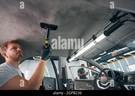 Portrait Of Worker Use Car Interior Steam Cleaner. Vapor Sterilization  Stock Photo, Picture and Royalty Free Image. Image 175110638.