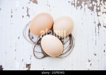 eggs lie on an old white table. Stock Photo