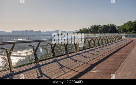 Kyiv, Ukraine 07.11.2020. Pedestrian glass bridge in Kyiv, Ukraine, on a sunny summer morning Stock Photo