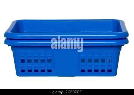 Empty basket isolated. Two empty blue rectangular stacked plastic laundry baskets isolated on a white background. Household equipment. Clipping path. Stock Photo