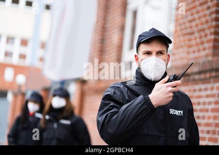 Security Officer Staff Or Bodyguard Protection In Face Mask Stock Photo