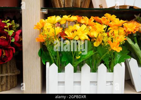 artificial yellow flowers in bouquet made from cloth, objest of interiors Stock Photo