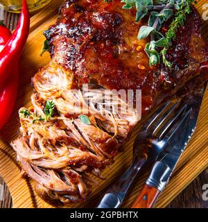 Pulled pork out of the oven with beer sauce Stock Photo