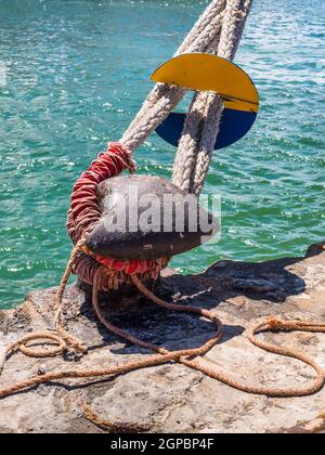 Rat guards on ship mooring ropes to prevent Rats getting aboard Stock ...