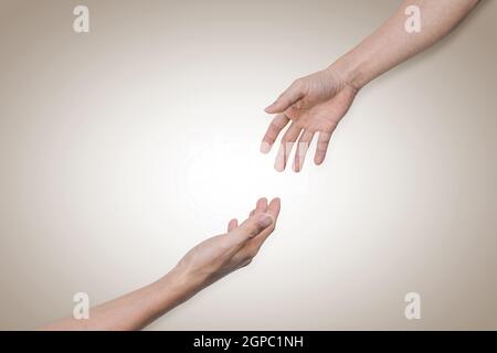 Giving a helping hand, hope and support each other. Help and solidarity concept Stock Photo