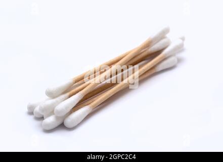 A heap of ecological recyclable cleaning cotton swabs from recycled paper. It used for better environmental conservation. Cotton swabs on white backgr Stock Photo