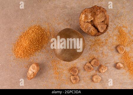 Monk fruit, siraitia grosvenorii , luo han guo and brown sugar top view. Stock Photo