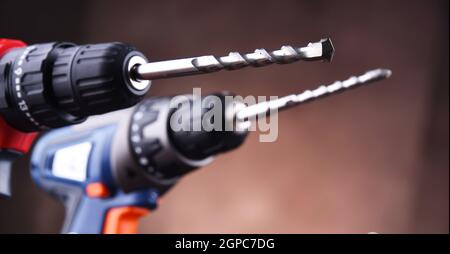 Composition with two cordless drills also working as screw guns Stock Photo
