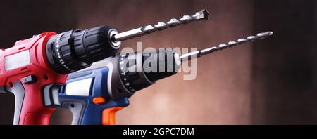 Composition with two cordless drills also working as screw guns Stock Photo