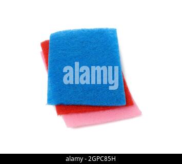 stack of new multi-colored kitchen sponges for washing dishes on a white background, close up Stock Photo