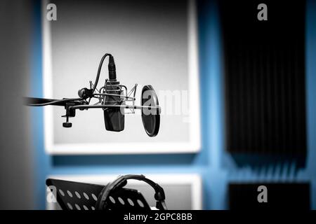 microphone in the studio ready to record voice and music. Stock Photo