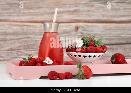 Homemade strawberry and raspberry fruit lemonade in jar Stock Photo