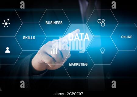 Man hand touching data word with icon business virtual screen concept. Stock Photo