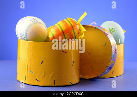 A couple gift boxes and easter eggs for the holiday season. Stock Photo