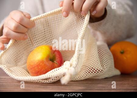 apples in an environmentally friendly bag, Eco friendly bag with red fresh apples with copy space, Fruit,Health,environment concept space for text Stock Photo
