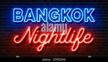 Neon sign on a brick wall - Bangkok Nightlife Stock Photo