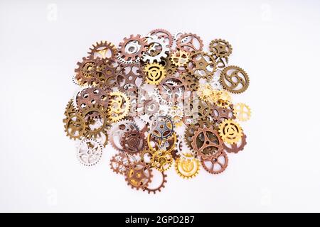 A pile of gear wheels and cogs in different colors. Future, gear, wheel, metal. Industrial concept. Stock Photo