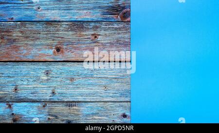 Light blue cardstock on an old wooden table in antiqued pastel