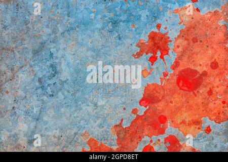 Grunge texture, red paint stains over worn zinc metal plate surface, top view Stock Photo