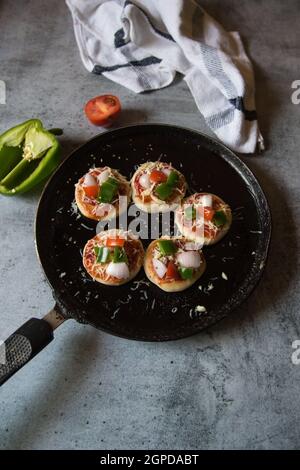 Popular Italian delicacy pizza. Ready to serve pizzas along with ingredients Stock Photo