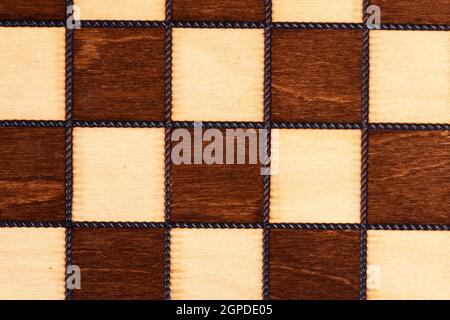 Wooden chessboard close up for background Stock Photo