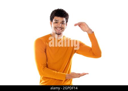 Young black afro guy laughing and pointing to something with his finger isolated on a white background Stock Photo