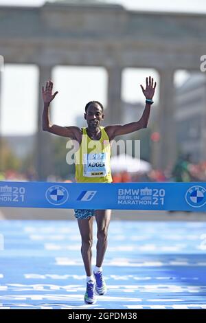 Guye Adola (ETH) celebrates after winning the men's race in 2:05:45 during the Berlin Marathon, Sunday, Sept. 26, 2021, in Berlin. (Jiro Mochizuki/Ima Stock Photo