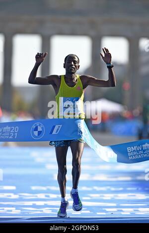 Guye Adola (ETH) celebrates after winning the men's race in 2:05:45 during the Berlin Marathon, Sunday, Sept. 26, 2021, in Berlin. (Jiro Mochizuki/Ima Stock Photo