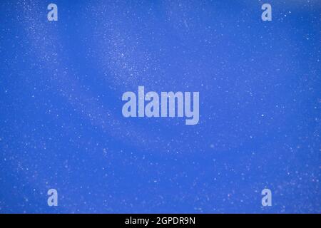Blue glitter abstract background. Glamorous blue glittering magical bright festive background for New Year's party decor. High quality photo Stock Photo