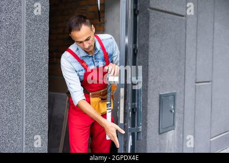 Man installing a door. renovation in a renovated building Stock Photo