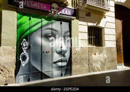 Valencia street art Old Town Spain Valencia Old Town Closed Negrita bar decorated doors Stock Photo