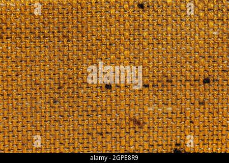 Rustic canvas fabric texture in orange woven color. Stock Photo