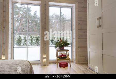 Bright photo studio interior with big window, high ceiling, white wooden floor Stock Photo