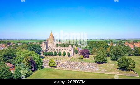 Aerial shot of Crowland Abbey, Lincolnshire, Peterborough on a glorious summer day with perfect blue sky Stock Photo