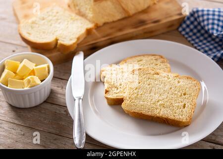 Braided egg bread on wooden table Stock Photo
