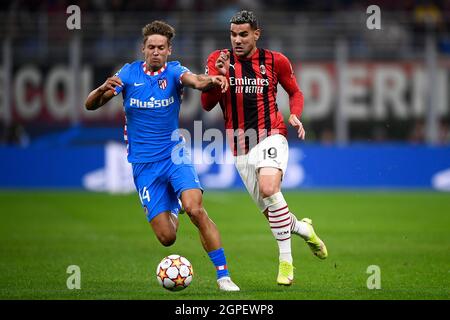 Milan, Italy. 28 September 2021. Theo Hernandez (R) of AC Milan is challenged by Marcos Llorente of Club Atletico de Madrid during the UEFA Champions League football match between AC Milan and Club Atletico de Madrid. Credit: Nicolò Campo/Alamy Live News Stock Photo