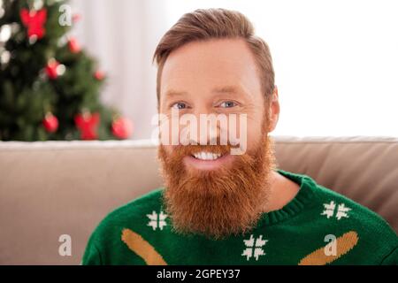 Portrait of young handsome smiling good mood guy celebrate new year merry christmas enjoying winter holiday at home Stock Photo